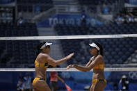 Agatha Bednarczuk and Eduarda Santos Lisboa, of Brazil, celebrates a point against Argentina during a women's beach volleyball match at the 2020 Summer Olympics, Saturday, July 24, 2021, in Tokyo, Japan. (AP Photo/Felipe Dana)