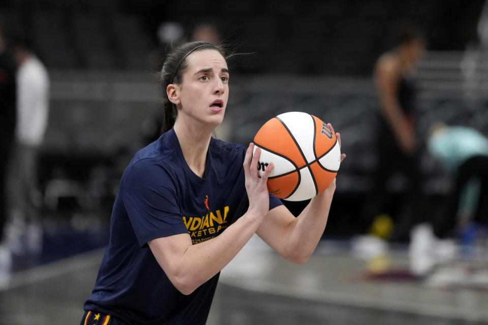 Indiana Fever guard Caitlin Clark warms up before a WNBA basketball game against the New York Liberty, Thursday, May 16, 2024, in Indianapolis. (AP Photo/Michael Conroy)