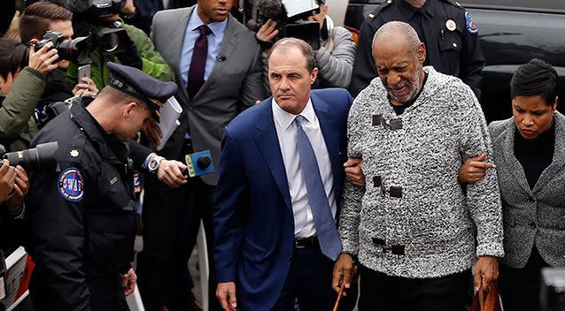 ill Cosby, centre, accompanied by his lawyerss Brian McMonagle, left, and Monique Pressley, arrives at court to face a felony charge of aggravated indecent assault in 2015. Photo: AP