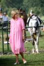 <p>Proving that she knows how to tackle off-duty maternity dressing, Princess Diana chose a millennial pink oversized dress for a trip to the polo back in May 1982. <em>[Photo: Getty]</em> </p>