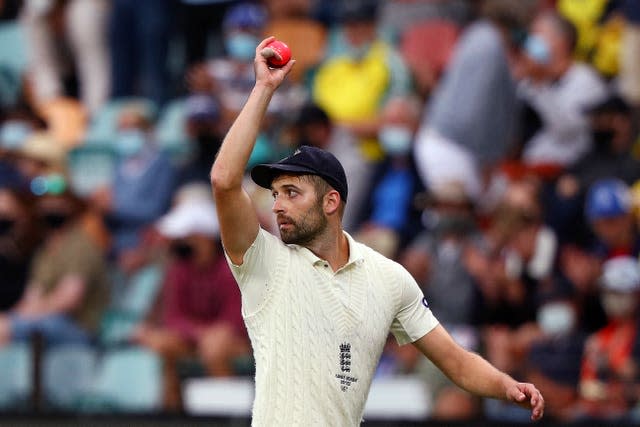 Mark Wood holds up the ball after taking six wickets 