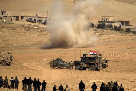 Smoke rises after a rocket landed in the middle of the Iraqi rapid response forces' position during a battle against Islamic State militants in the south of Mosul, Iraq February 19, 2017. REUTERS/Zohra Bensemra