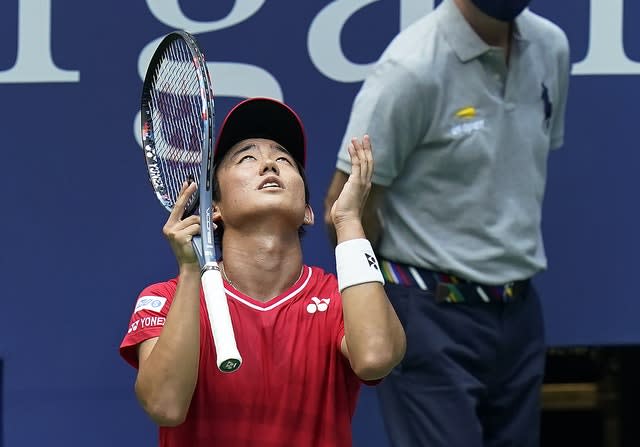 Yoshihito Nishioka, of Japan, reacts after losing a point