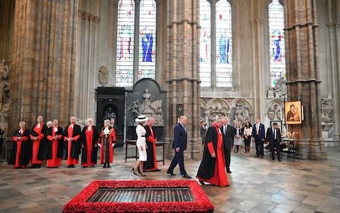 Donald and Melania Trump walking through Westminster Abbey - Credit: Mandel Ngan/AFP