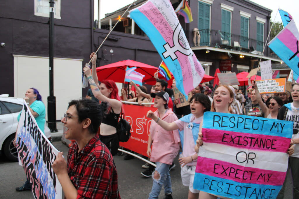 Marchers walk through the French Quarter in New Orleans for Transgender Day of Visibility