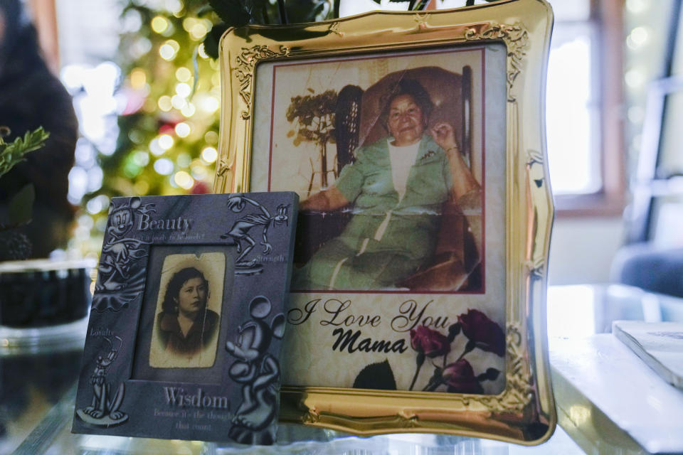 Pictures of Noelia Sanchez, left, and her mother Aurora Sandoval are displayed at the family home Tuesday, Dec. 26, 2023, in Chicago. When she was 1, Noelia and her mother, Aurora, who had no work documents, were rounded up with dozens of other immigrants in a Texas town near the border. The U.S.-born child and her mother were forced to go to Mexico along with hundreds of thousands of other people. (AP Photo/Erin Hooley)