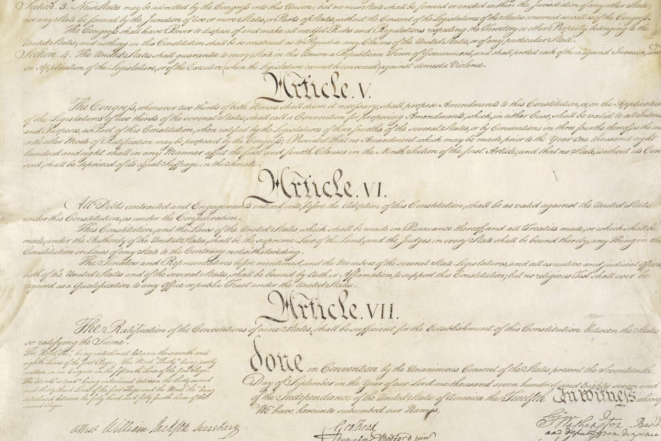 This photo made available by the U.S. National Archives shows a portion of the United States Constitution with Articles V-VII. For the past two centuries, constitutional amendments have originated in Congress, where they need the support of two-thirds of both houses, and then the approval of at least three-quarters of the states. But under a never-used second prong of Article V, amendments can originate in the states. (National Archives via AP)