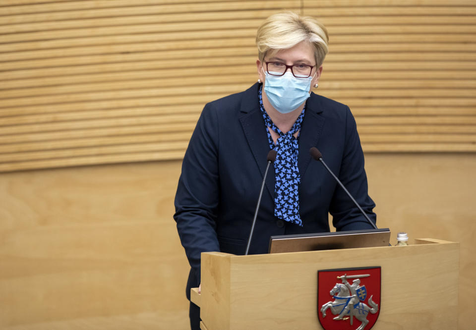 Lithuania's Homeland Union and Lithuanian Christian Democrats party leader Ingrida Simonyte speaks in parliament in Vilnius, Lithuania, Tuesday, Nov. 24, 2020. Lithuania's parliament approved Ingrida Simonyte as the new prime minister on Tuesday. (AP Photo/Mindaugas Kulbis)