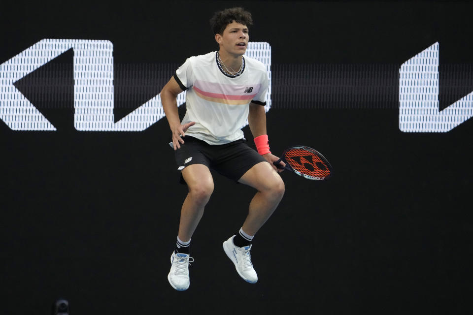 Ben Shelton of the U.S. reacts as he waits to return a shot to compatriot J.J. Wolf during their fourth round match at the Australian Open tennis championship in Melbourne, Australia, Monday, Jan. 23, 2023. (AP Photo/Ng Han Guan)