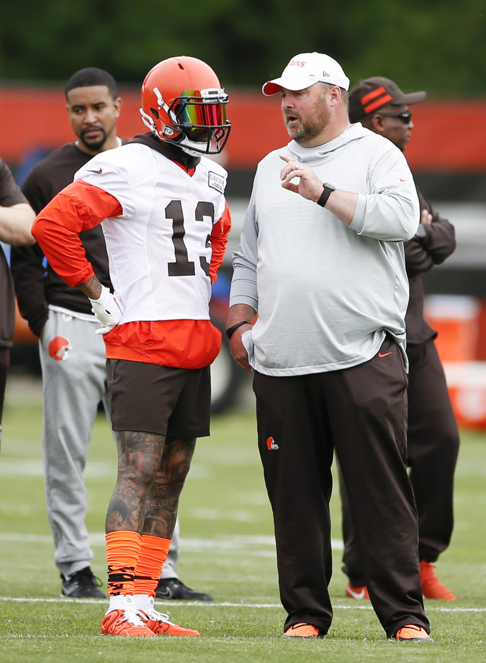 Cleveland Browns wide receiver Odell Beckham Jr. (13) talks with head coach Freddie Kitchens at the team's NFL football training facility in Berea, Ohio, Tuesday, June 4, 2019. (AP Photo/Ron Schwane)