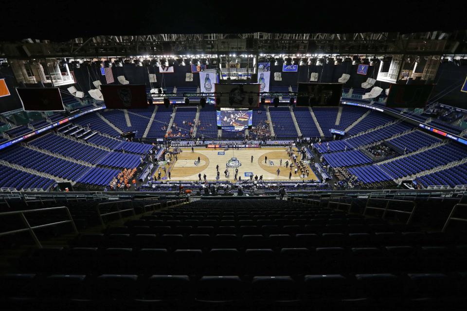 FILE - Greensboro Coliseum is mostly empty after the NCAA college basketball games at the Atlantic Coast Conference tournament were cancelled in Greensboro, N.C., March 12, 2020. The 2019-20 season marked only the second time that as many as seven teams had been ranked No. 1 in the AP men’s college basketball poll as the COVID-19 pandemic forced the cancellation of the NCAA Tournament. (AP Photo/Gerry Broome, File)