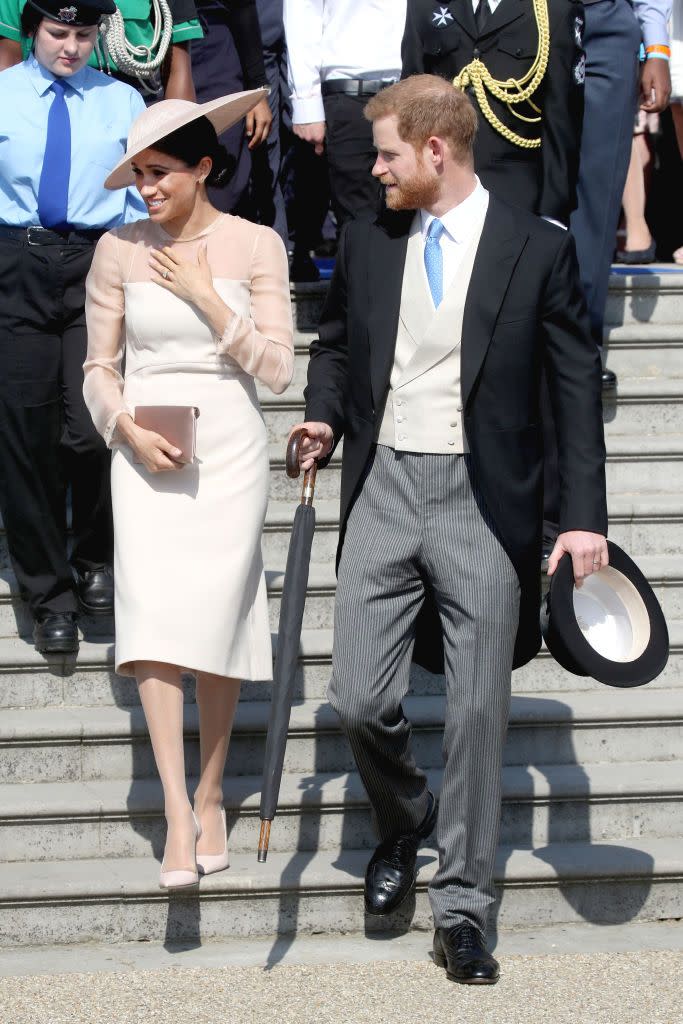 The newlyweds attend a garden party at Buckingham Palace to celebrate Prince Charles's 70th birthday.