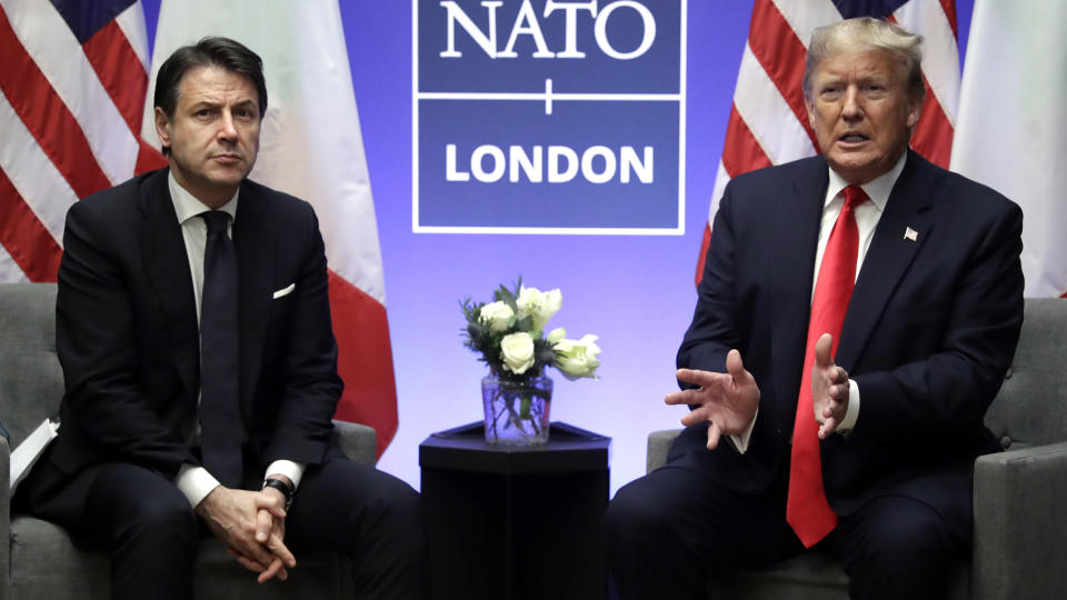 FILE - In this Wednesday, Dec. 4, 2019 file photo, President Donald Trump meets with Italian Prime Minister Giuseppe Conte during the NATO summit at The Grove, in Watford, England. When Giuseppe Conte exited the premier’s office, palace employees warmly applauded in him appreciation. But that’s hardly likely to be Conte’s last hurrah in politics. Just a few hours after the handover-ceremony to transfer power to Mario Draghi, the former European Central Bank chief now tasked with leading Italy in the pandemic, Conte dashed off a thank-you note to citizens that sounded more like an ’’arrivederci″ (see you again) then a retreat from the political world he was unexpectedly propelled into in 2018. (AP Photo/ Evan Vucci)