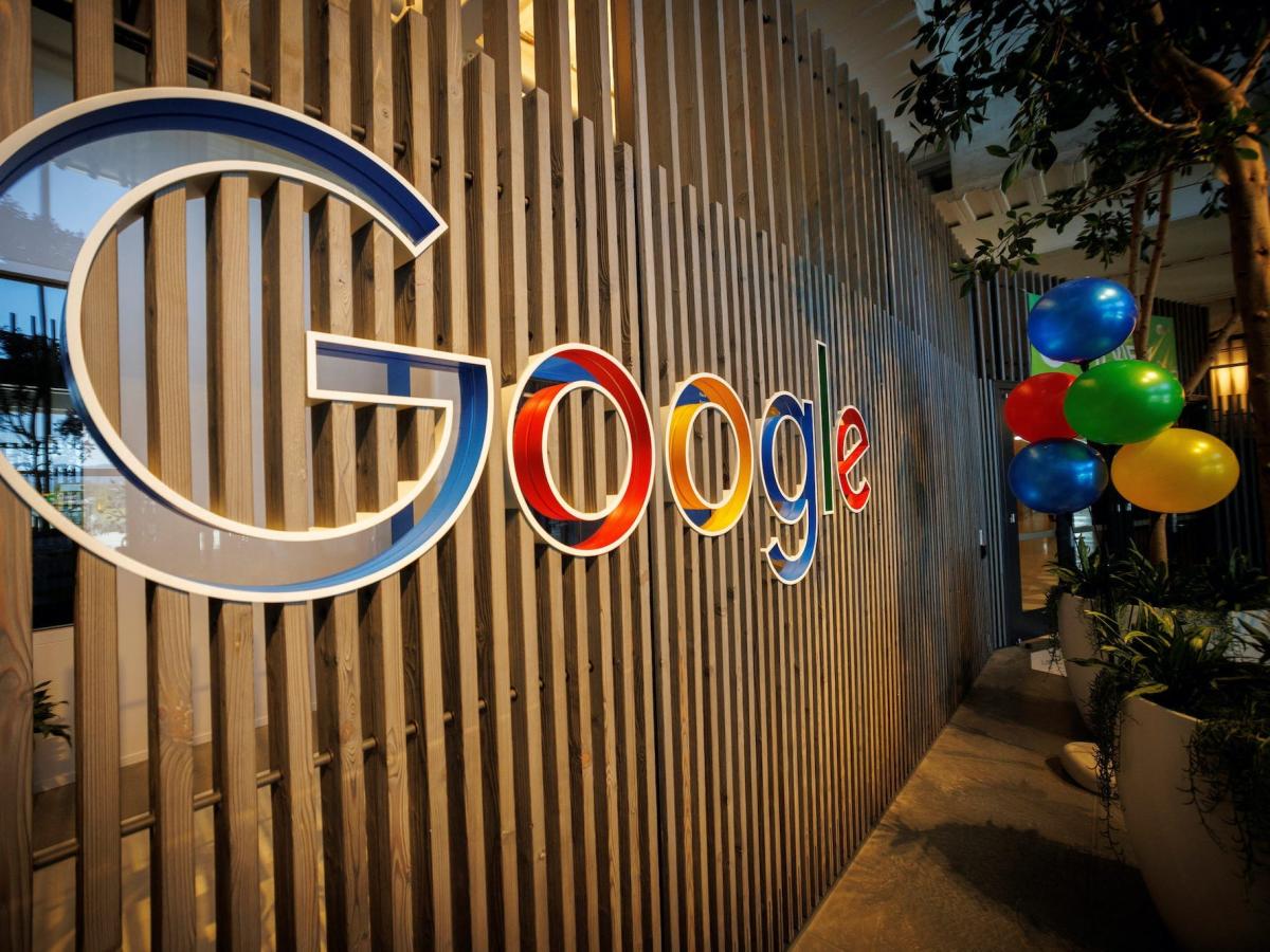  Google's logo is displayed on a wooden wall in the company's office, illustrating the concern about chatbots providing inaccurate election information.