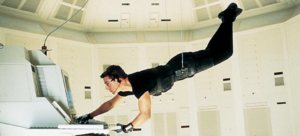 Ethan Hunt (Tom Cruise) dangles over a floor teeming with sensors as he tries to hack the C.I.A. mainframe in Langley, Virginia in order to catch a mole threatening to expose the true identities of its agents across the globe.