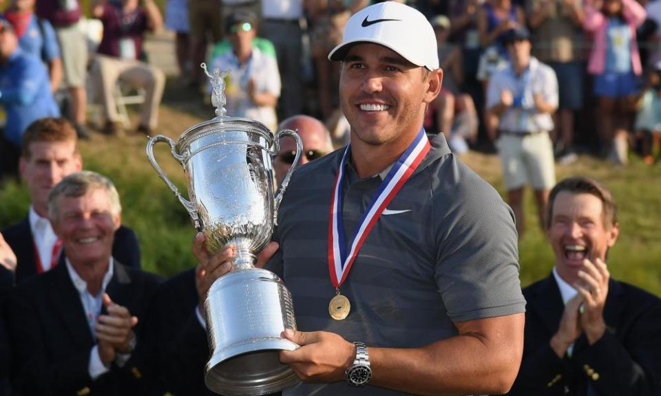 Brooks Koepka celebrates with the US Open trophy during after winning by a shot at Shinnecock Hills.