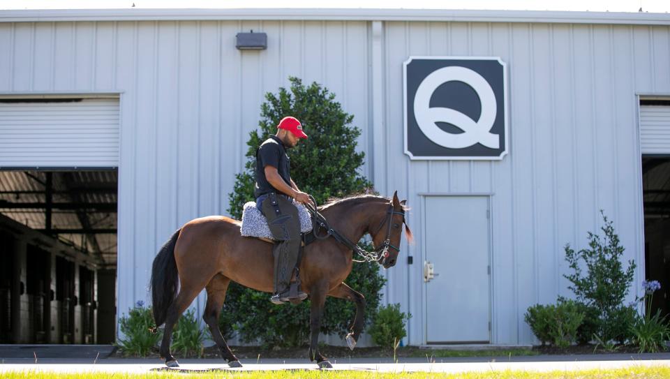 Emanuel Castellar rides Jordan, a Paso Fino horse, by Barn Q at the World Equestrian Center on May 20.