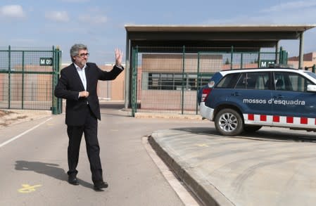 Lawyer Jordi Pina waves to supporters as he leaves the Lledoners prison in Catalonia where jailed Catalan leaders awaited a verdict in a trial over a banned independence referendum in Sant Joan de Villatorrada