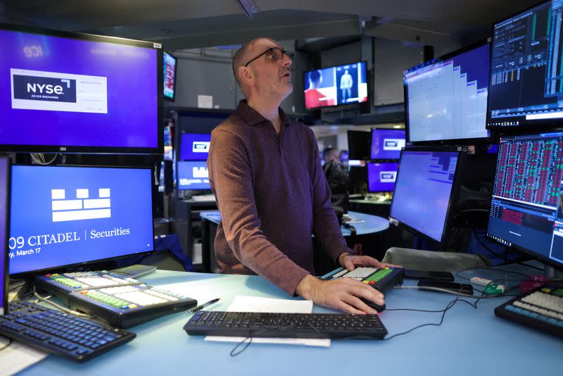 A trader works on the trading floor at the New York Stock Exchange (NYSE) in New York City