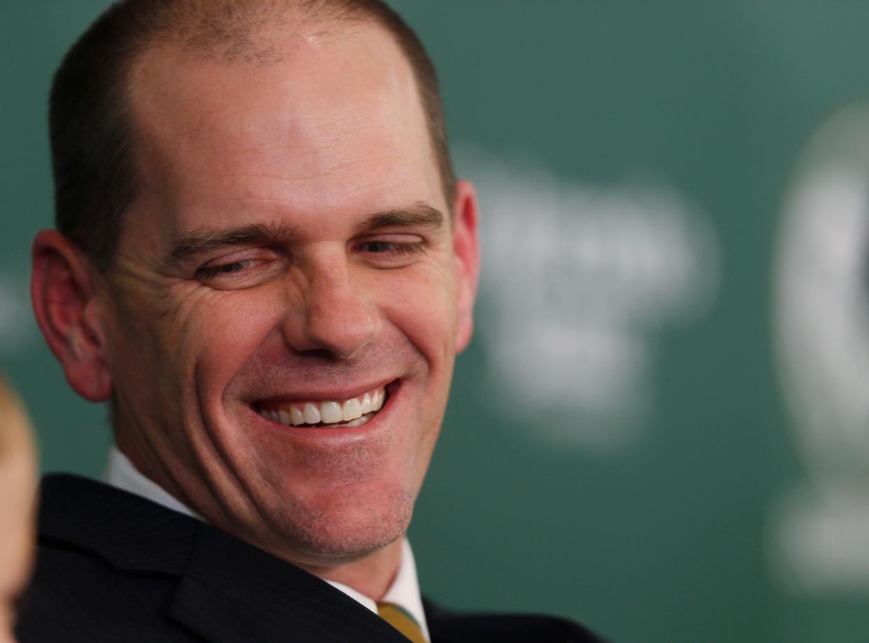 Mike Bobo smiles during his introduction as the new head football coach at Colorado State at a news conference Tuesday, Dec. 23, 2014, in Fort Collins, Colo. Bobo, who was the offensive coordinator at the University of Georgia, succeeds Jim McElwain, who left after three seasons to become the head football coach at the University of Florida. (AP Photo/David Zalubowski)