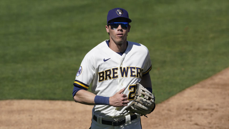 Milwaukee Brewers right fielder Christian Yelich (22) runs to the dugout during a spring training baseball game Saturday, March 6, 2021, in Scottsdale, Ariz. (AP Photo/Ashley Landis)