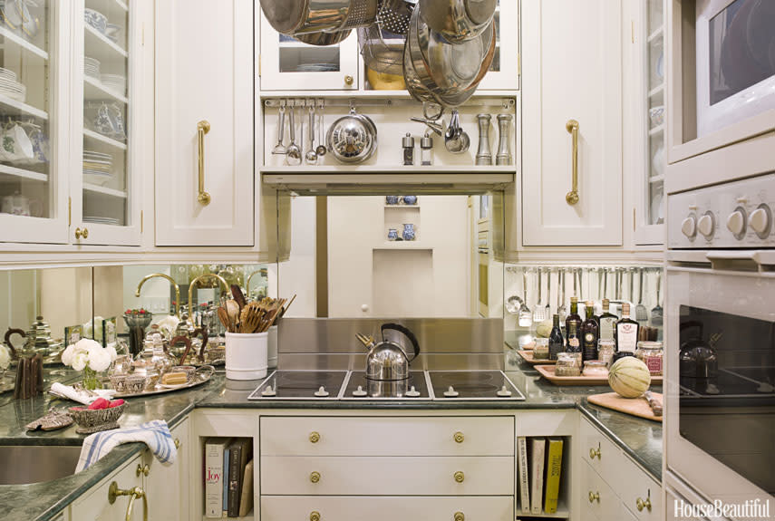 <div class="caption-credit"> Photo by: Eric Piasecki</div><div class="caption-title">Walk-In Closet–Size Kitchen</div><p> In designer Stephanie Stokes's 48-square-foot kitchen in New York City, everything is efficient and has its own place. "To fit everything in, I had to shave every element of the design," she says. "My marble countertops are only three-quarters of an inch thick, rather than the usual inch and a quarter, and that gave me half an inch more room to use above or below. There are knife slots built into the counter. I even used the spaces between the studs in the walls. I found two inches above the stove hood and used it for storage." The mirrored backsplash, electric cooktop that doubles as countertop, and simple cabinetry give the illusion of grandeur in the tiny space. </p> <p> <b>See more:</b> </p> <p> <a rel="nofollow noopener" href="http://www.housebeautiful.com/decorating/ideas/small-space-design-ideas?link=emb&dom=yah_life&src=syn&con=blog_housebeautiful&mag=hbu" target="_blank" data-ylk="slk:11 Ways to Maximize a Small Space;elm:context_link;itc:0;sec:content-canvas" class="link "><b>11 Ways to Maximize a Small Space</b></a> <br> <br> <a rel="nofollow noopener" href="http://www.housebeautiful.com/decorating/outrageous-color-combinations-for-rooms?link=emb&dom=yah_life&src=syn&con=blog_housebeautiful&mag=hbu" target="_blank" data-ylk="slk:Unexpected Color Combos That Really Work;elm:context_link;itc:0;sec:content-canvas" class="link "><b>Unexpected Color Combos That Really Work</b></a> </p>