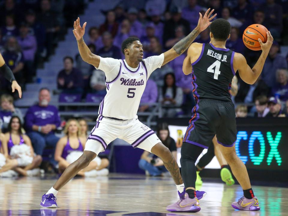 Kansas State guard Cam Carter (5) defends against TCU's Jameer Nelson (4) on Saturday at Bramlage Coliseum in Manhattan.