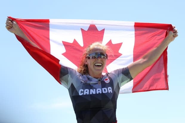 Canada's Laurence Vincent Lapointe reacts to winning the silver medal in the women's single canoe 200-metre final Thursday at Sea Forest Waterway in Tokyo. ( Laurence Griffiths/Getty Images - image credit)