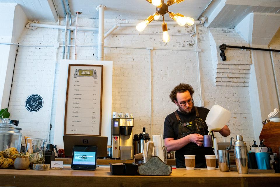 Chase Richmond Bobier, owner and operator of Wolf & Scout, creates coffee drinks in Columbia, Tenn. on Aug. 24, 2022. Bobier is moving locations after over a year in the Columbia arts district and will be turning over his lease to another growing business in Columbia. 