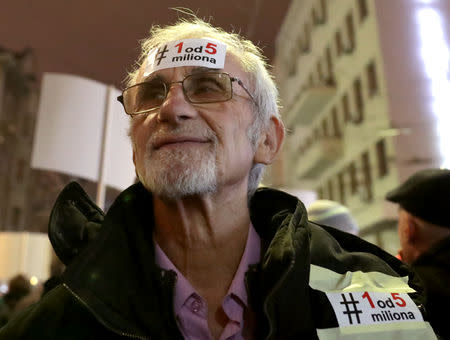 A demonstrator attends an anti-government protest in central Belgrade, Serbia, December 29, 2018. The sticker reads "1 of 5 million". REUTERS/Marko Djurica