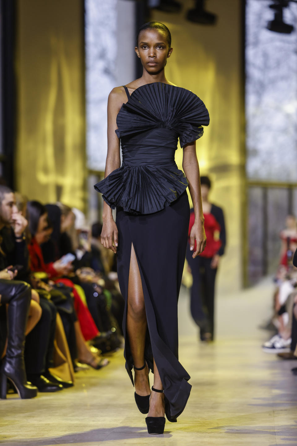 A model wears a creation as part of the Elie Saab Fall/Winter 2023-2024 ready-to-wear collection presented Saturday, March 4, 2023 in Paris. (Vianney Le Caer/Invision/AP)