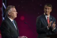 Virginia Democratic gubernatorial candidate and former Gov. Terry McAuliffe, left, and Republican challenger, Glenn Youngkin, participate in a debate at Northern Virginia Community College, in Alexandria, Va., Tuesday, Sept. 28, 2021. (AP Photo/Cliff Owen)