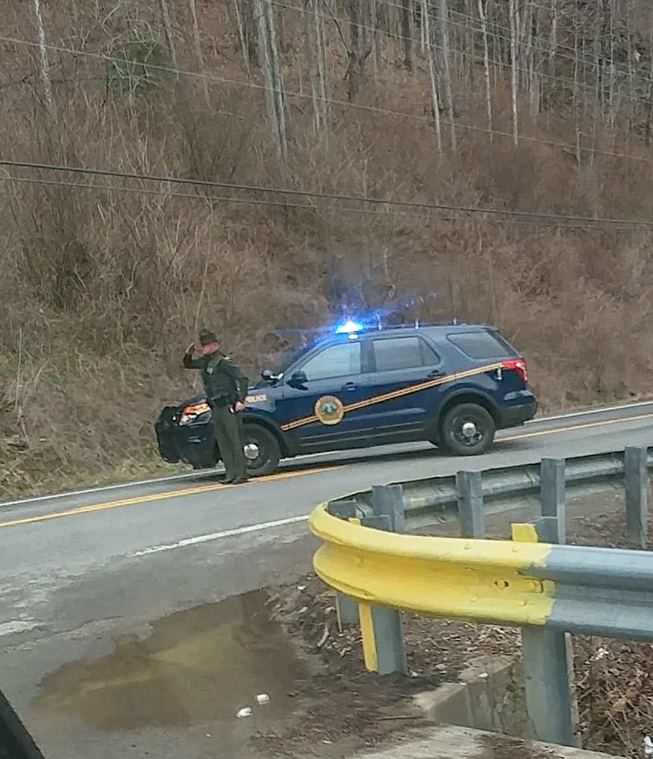 A West Virginia trooper salutes a funeral procession. (Photo: Tonjia Ray-Tompkins)