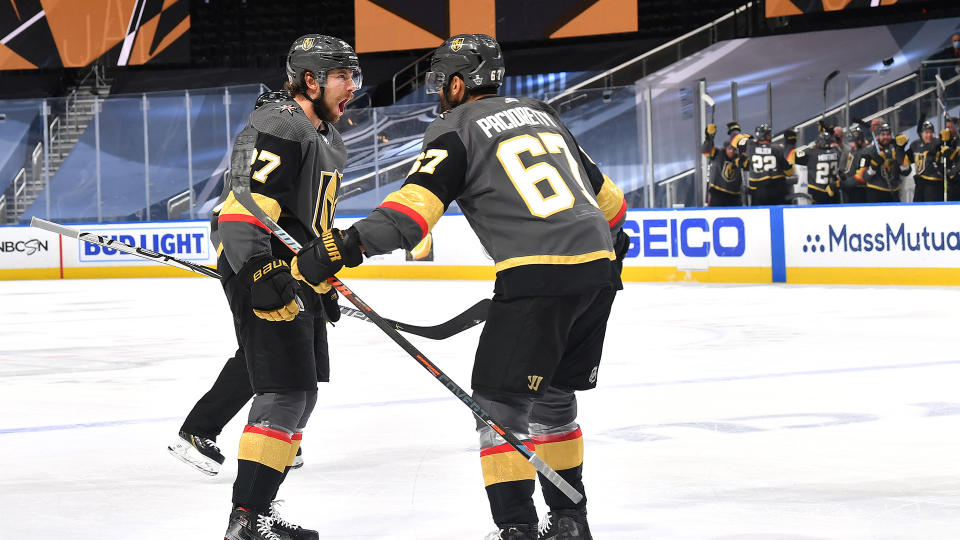 EDMONTON, ALBERTA - SEPTEMBER 04: Max Pacioretty #67, Shea Theodore #27 and the Vegas Golden Knights bench celebrate after Theodore scored a power play goal against the Vancouver Canucks during the third period of Game Seven of the Western Conference Second Round of the 2020 NHL Stanley Cup Playoffs at Rogers Place on September 04, 2020 in Edmonton, Alberta. (Photo by Andy Devlin/NHLI via Getty Images)