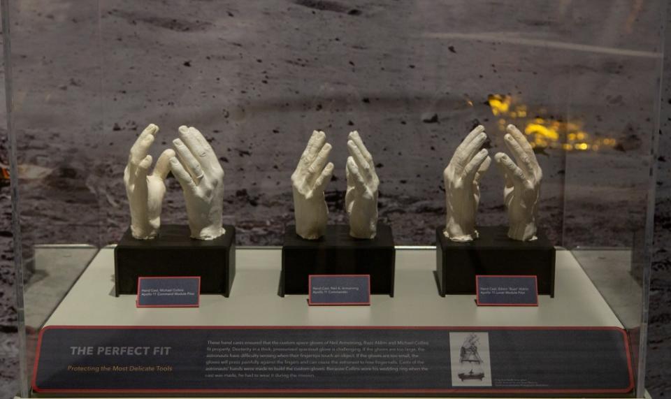 The exhibit, which features gear worn by Apollo crew, includes hand casts used to ensure custom fits for astronauts Michael Collins, left, Neil Armstrong and Edwin “Buzz” Aldrin. Intrepid Museum