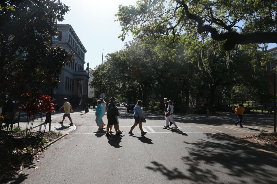 Pedestrians cross Oglethorpe Avenue on Bull Street.