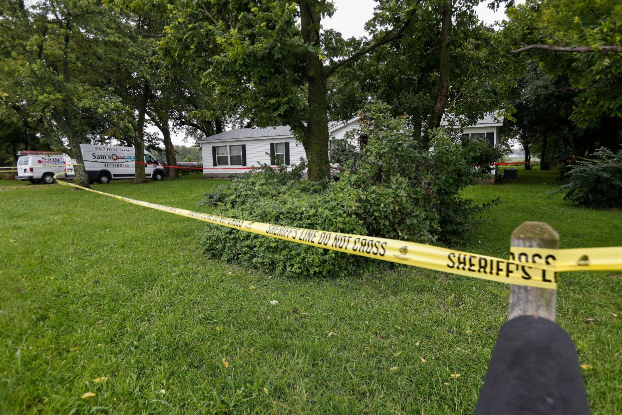 Deputies have a house surrounded by crime scene tape on Farm Road 182 in southeastern Greene County on Saturday, Sept. 8. 2018.