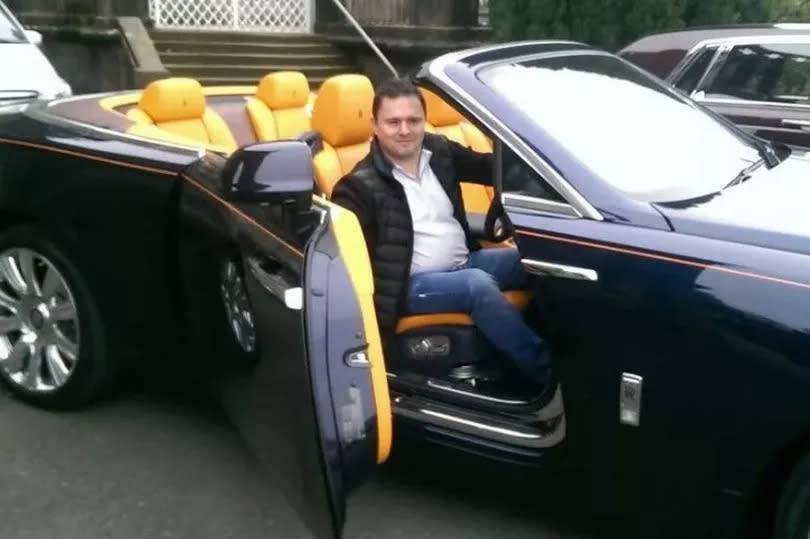Cold call king Duncan Paul in one of his flashy supercars