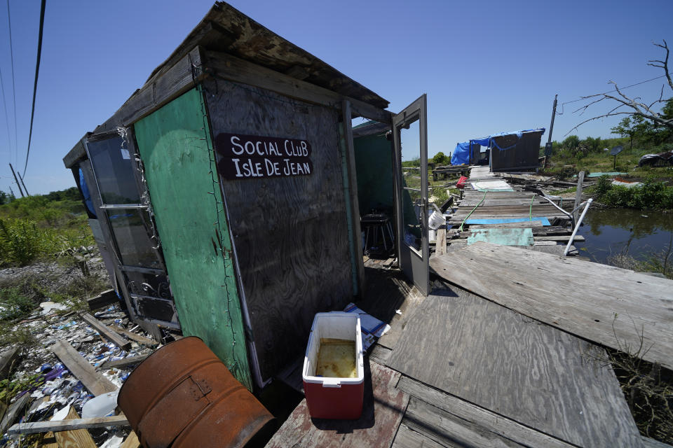 Destruction from Hurricane Ida, which tore through the bayou communities in August 2021, is seen on Isle de Jean Charles, La., Thursday, May 26, 2022. (AP Photo/Gerald Herbert)