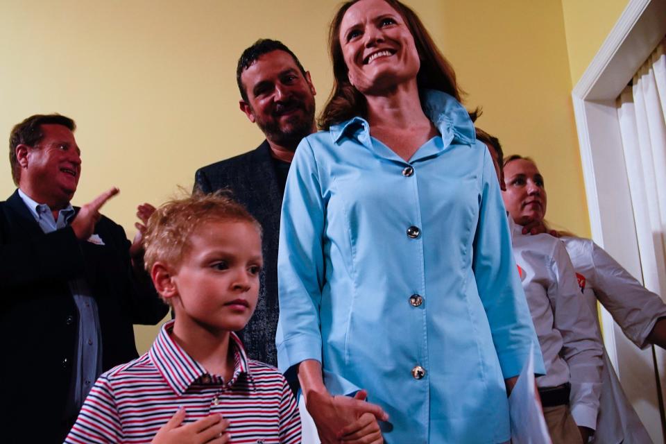 Alice Rolli stands with her family during an election night party on Thursday, Aug. 3, 2023 in Nashville, Tenn.