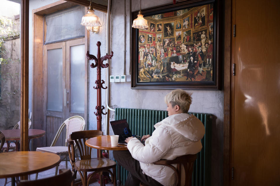 A patron works on a laptop at Metal Hands coffee shop in Beijing. (Fred Dufour / NBC News)