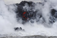 <p>Steam rises as lava flows into the ocean near Pahoa, Hawaii, May 20, 2018. (Photo: Jae C. Hong/AP) </p>