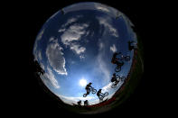 LONDON, ENGLAND - AUGUST 09: The field clear a jump during the Men's BMX Cycling Quarter Finals on Day 13 of the London 2012 Olympic Games at BMX Track on August 9, 2012 in London, England. (Photo by Phil Walter/Getty Images)