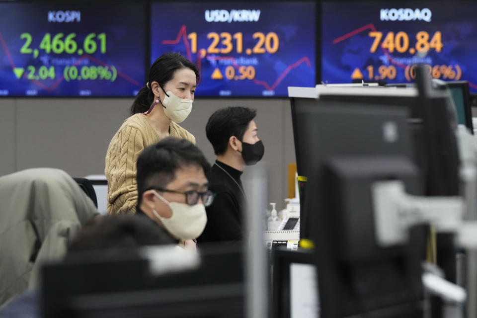 Currency traders watch monitors at the foreign exchange dealing room of the KEB Hana Bank headquarters in Seoul, South Korea, Friday, Jan. 27, 2023. Asian shares advanced Friday, tracking a rally on Wall Street following reports suggesting the economy and corporate profits may be doing better than feared. (AP Photo/Ahn Young-joon)