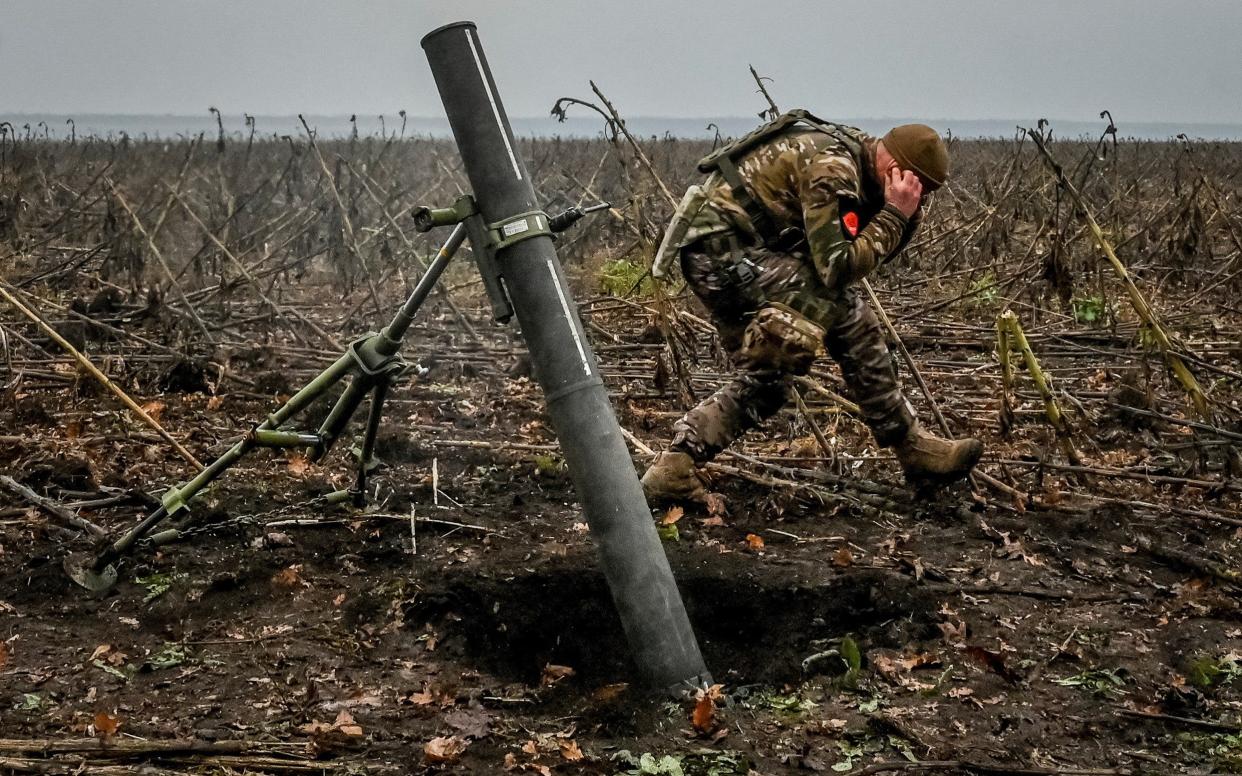 A Ukrainian serviceman fires a mortar on a front line, as Russia's attack on Ukraine continues, in the Zaporizhzhia region - REUTERS