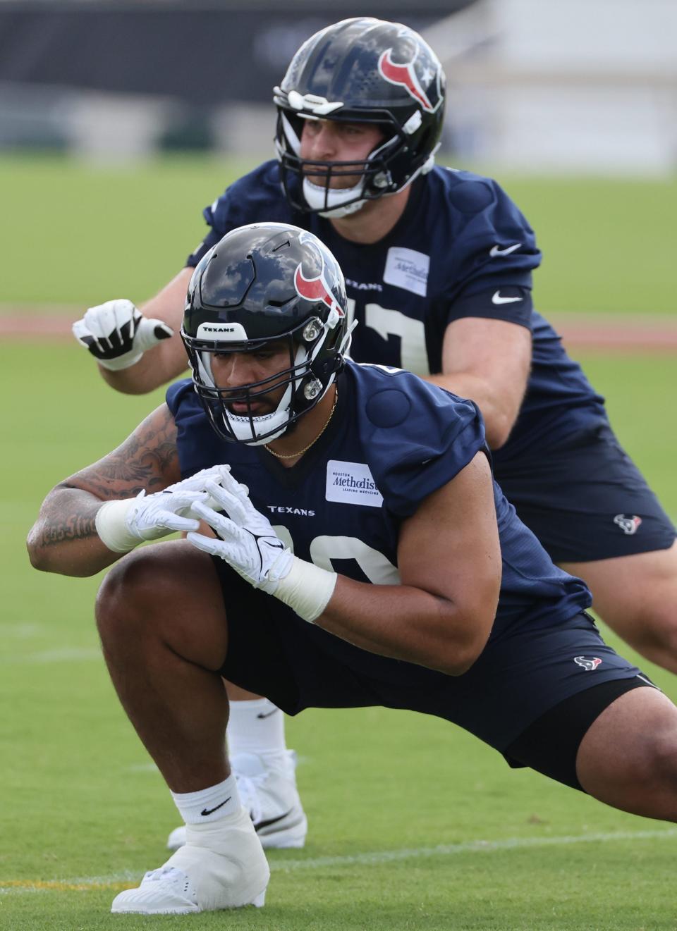 Cathedral Prep graduate Frederick "Juice" Scruggs stretches during this year's Houston Texans rookie camp. Houston picked Scruggs, a Penn State University offensive lineman, in the second round of April's NFL draft. Scruggs suffered a hamstring pull in the Texans' last preseason game. He was finally cleared to play and appeared in his first game when Houston hosted Jacksonville last Sunday.