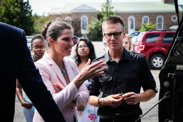 Dave Risk, right, speaking with then-minister of science Kirsty Duncan in 2017. Risk heads the FluxLab at St. Francis Xavier University, which drives to thousands of oil and gas sites in western Canada to measure methane leaks.