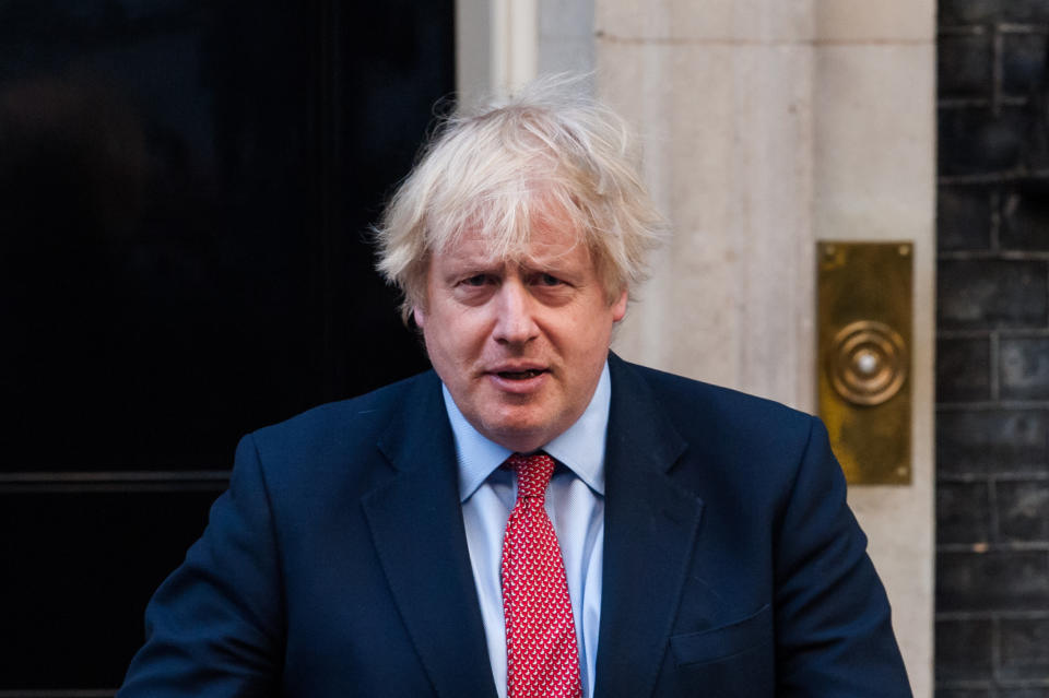 LONDON, UNITED KINGDOM - MAY 28, 2020: British Prime Minister Boris Johnson claps his hands outside 10 Downing Street during the weekly 'Clap for our Carers' applause for the NHS and key workers on the front line of the coronavirus (Covid-19) pandemic on 28 May, 2020 in London, England. The founder of the event, Ms Annemarie Plas, suggested that after the 10th applause this week, the show of appreciacion should be made an annual event to avoid it being politicised.- PHOTOGRAPH BY Wiktor Szymanowicz / Barcroft Studios / Future Publishing (Photo credit should read Wiktor Szymanowicz/Barcroft Media via Getty Images)