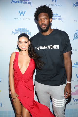 <p>Alexander Tamargo/Getty</p> Anne de Paula and Joel Embiid