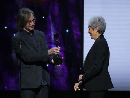 32nd Annual Rock & Roll Hall of Fame Induction Ceremony - Show – New York City, U.S., 07/04/2017 – Presenter Jackson Browne with inductee Joan Baez. REUTERS/Lucas Jackson